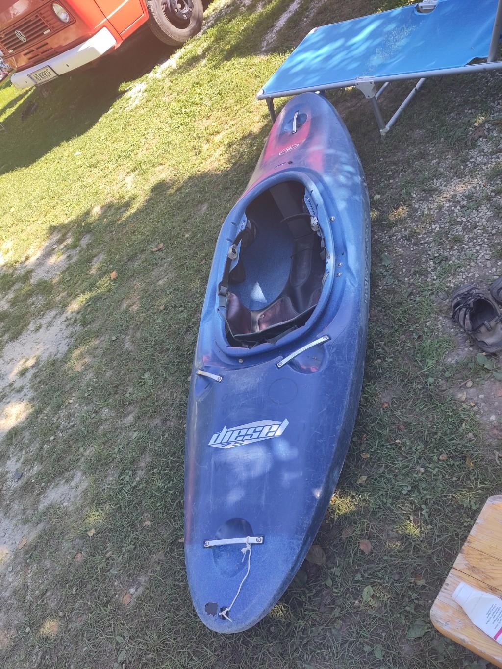 blue "Diesel 75" kayak on the gras